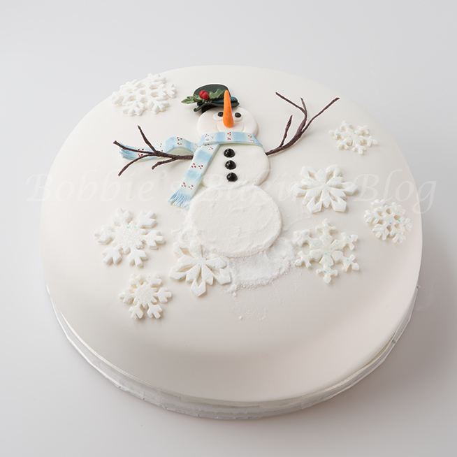 Learn how to create alan dunn's  sugar snowman cake 
